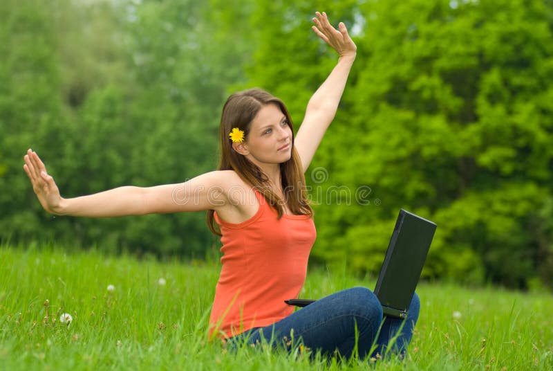 Young business woman relaxing, working on laptop c