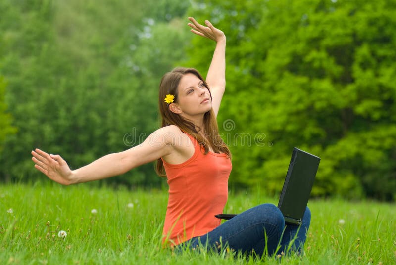 Young business woman relaxing, working on laptop c