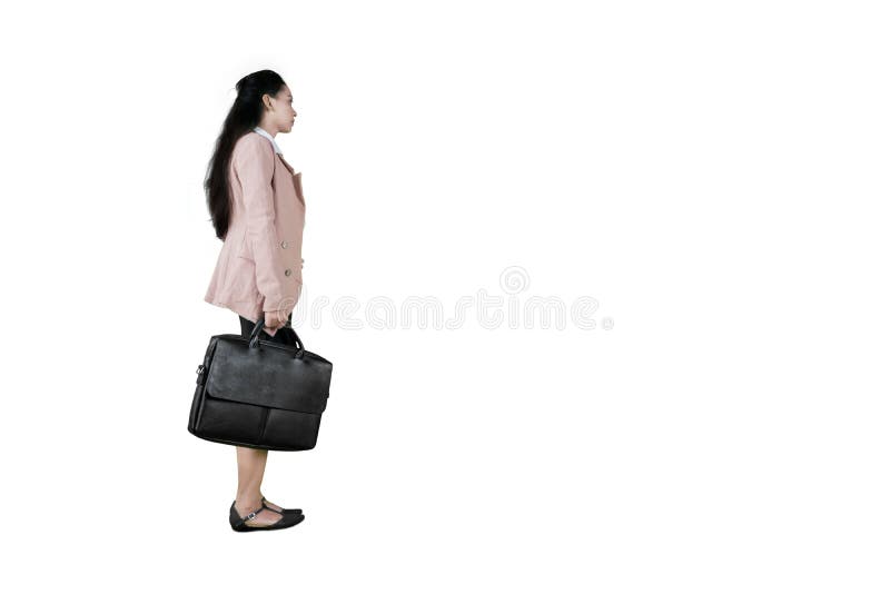 Business woman carrying briefcase in studio royalty free stock photos Business woman carrying briefcase in studio royalty free stock photos