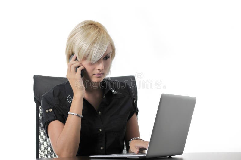 Young business woman working in office on laptop