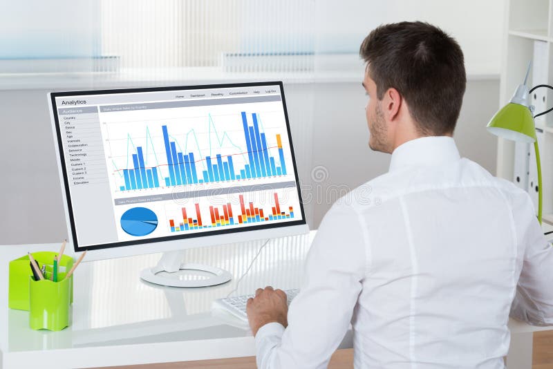 Businessman Analyzing Graphs On Computer royalty free stock photos