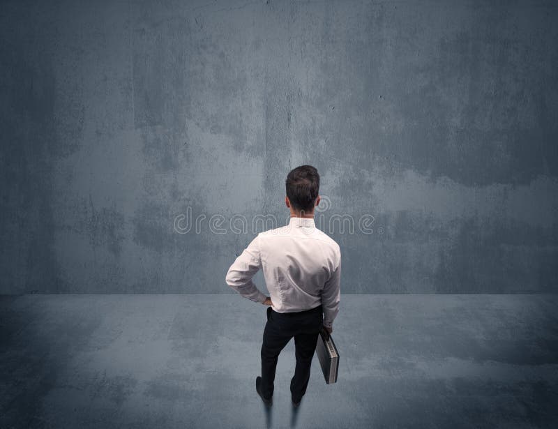 Businessman Standing in Front of Urban Wall Stock Photo - Image of ...