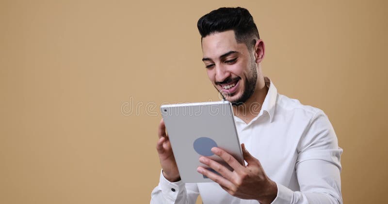 Young businessman having fun while using digital tablet stock footage