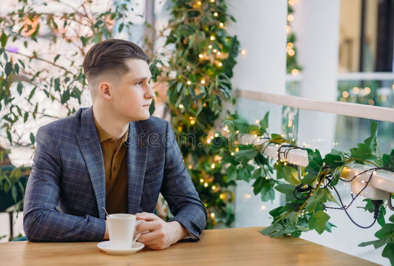 Young Businessman Having Lunch Break. Handsome Smart Man Drinking