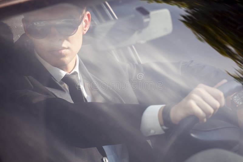 Young businessman in his car