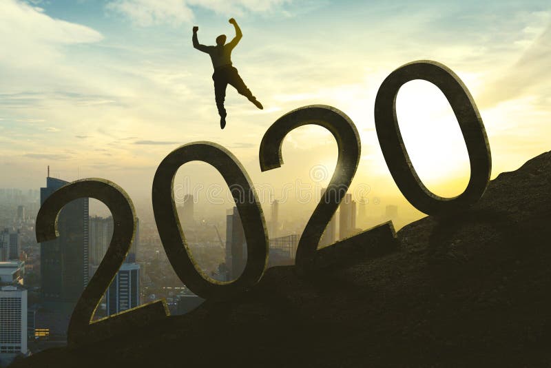 Young businessman jumping above number 2020 royalty free stock photo Young businessman jumping above number 2020 royalty free stock photo