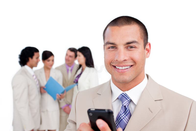 Young businessman looking at his cellphone