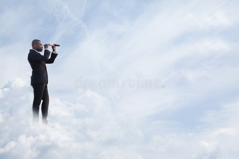 Young businessman looking through telescope in a dreamlike cloud world royalty free stock photography