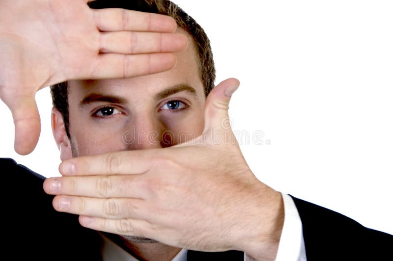 Young businessman making a finger frame in front