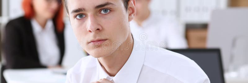 A young businessman at the meeting folded