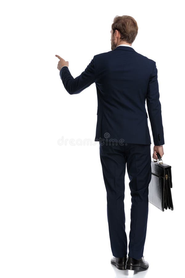 Young businessman in navy blue suit pointing finger