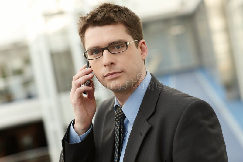 Young businessman in office space talking stock images
