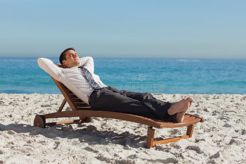 Young Businessman Relaxing on a Deck Chair Stock Photo - Image of ...