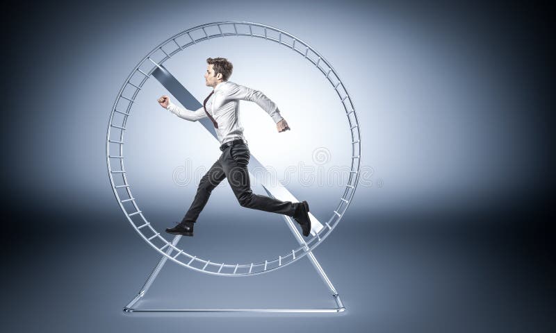 Work make me slave. Young businessman run in huge hamster wheele royalty free stock images