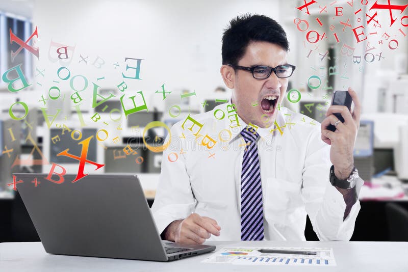 Young businessman screaming at mobilephone royalty free stock photos