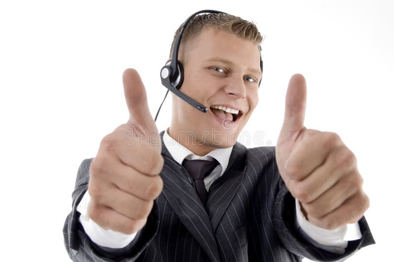 Young businessman showing thumbs up