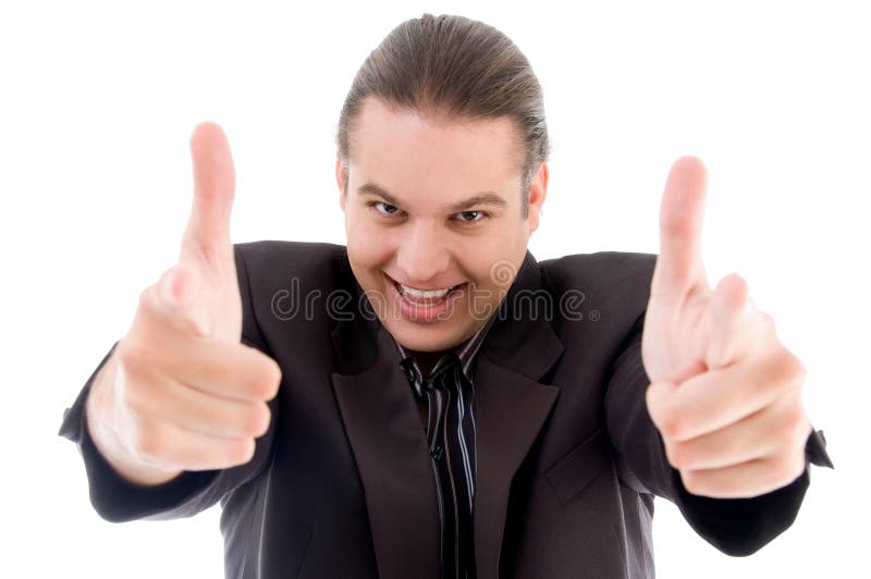 Young businessman showing thumbs up