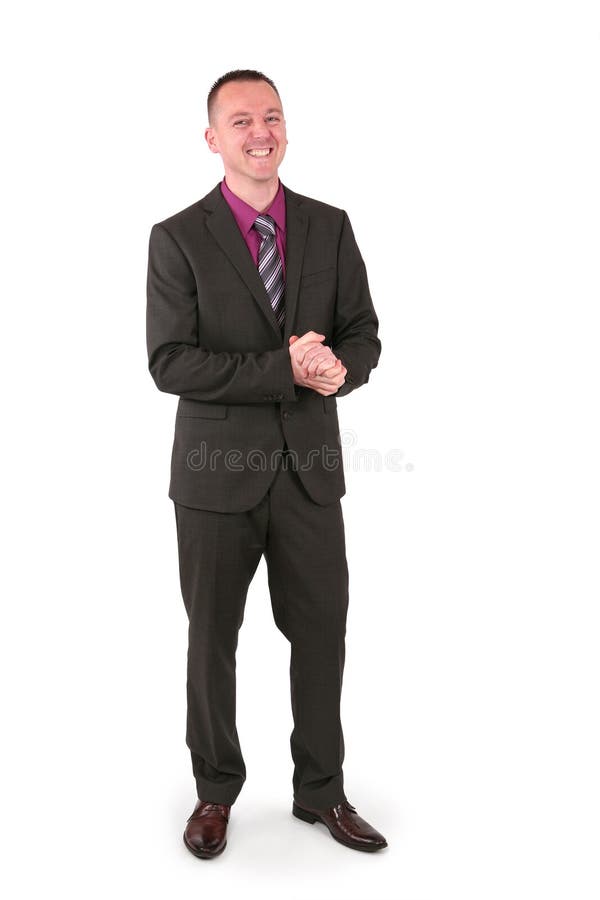 Young businessman in a suit with a big smile, isolated on white