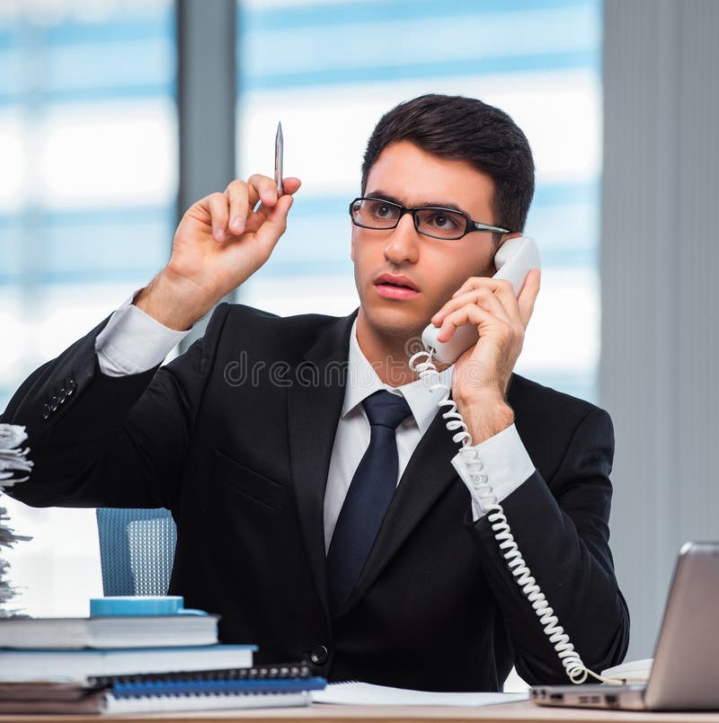 Young businessman talking on the phone stock images
