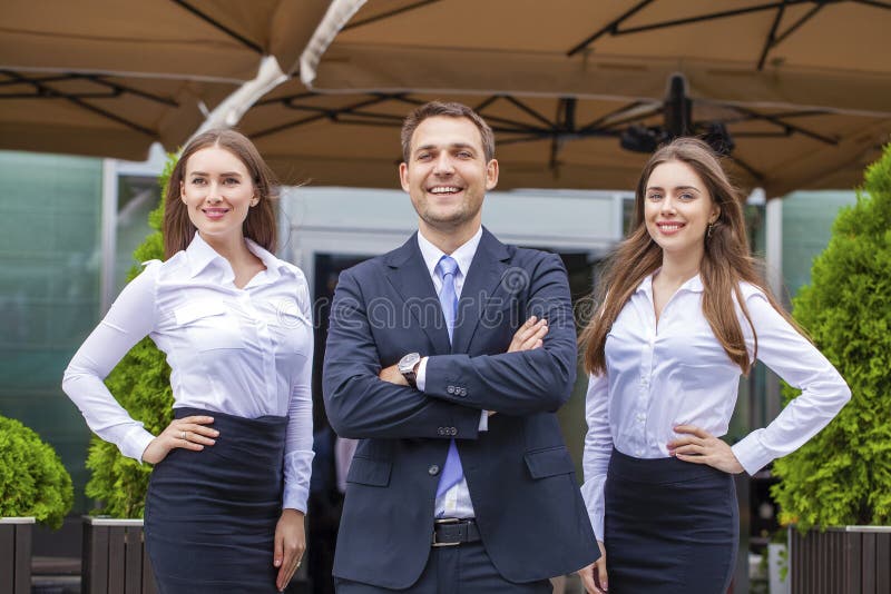 A young businessman with their secretaries