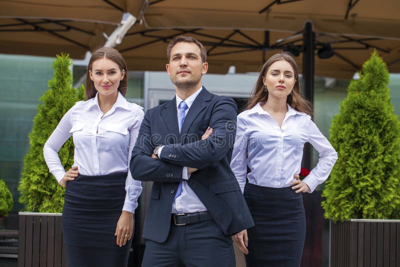 A young businessman with their secretaries