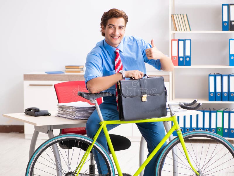 Young Businessman Using Bike To Commute To the Office Stock Photo