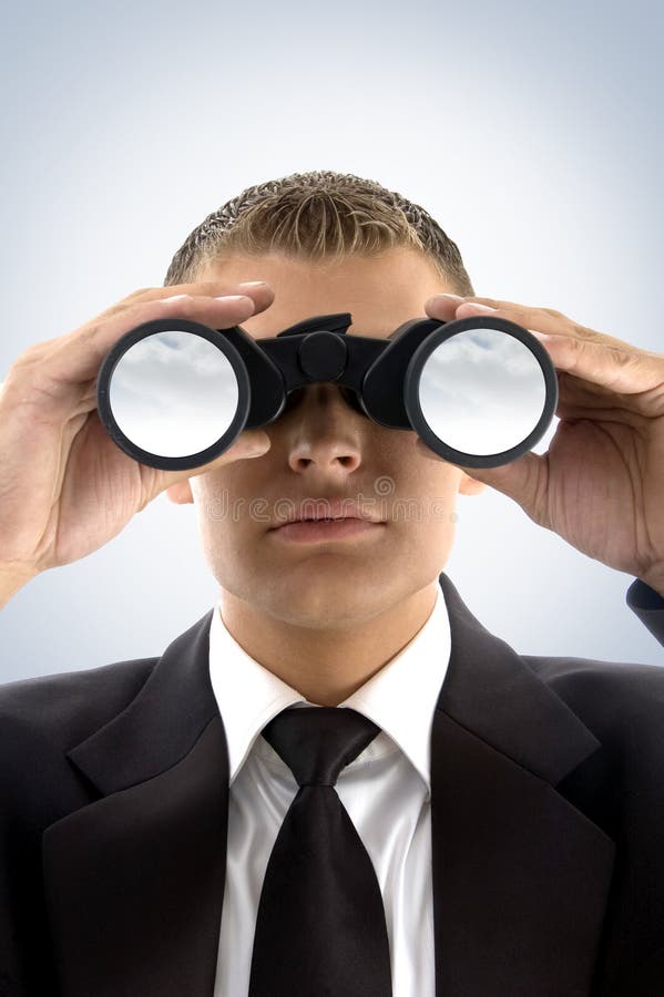 Young businessman using binoculars