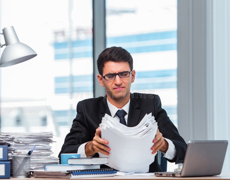 Young businessman working in the office stock image