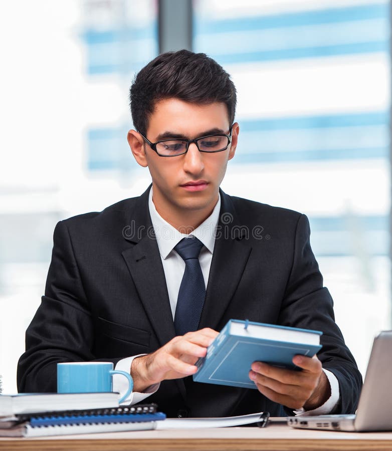 Young businessman working in the office stock photo