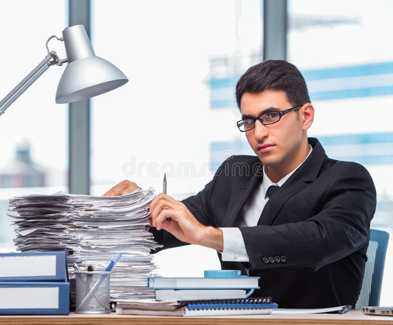 Young businessman working in the office stock photography