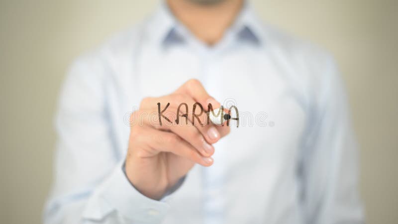 Karma , man writing on transparent wall