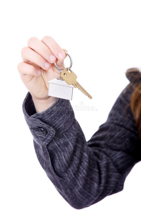 Young businesswoman with house keys royalty free stock photography