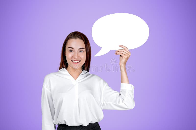 Young businesswoman mockup speech bubble on violet background stock photography