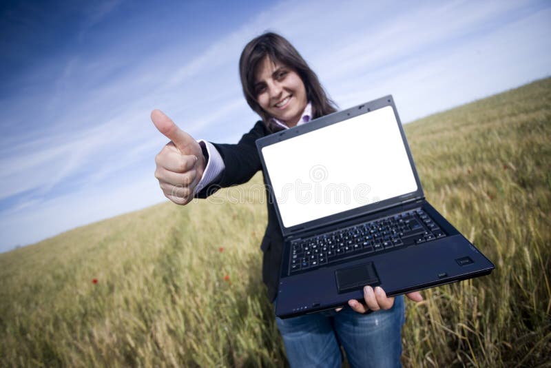 Young businesswoman outdoor with laptop