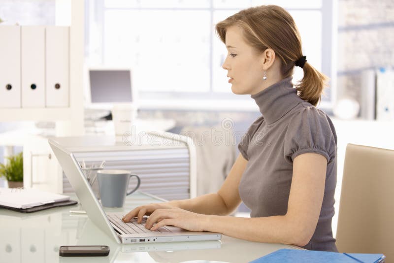 Young businesswoman using laptop