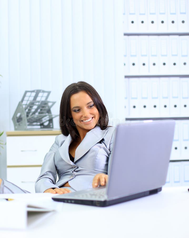 Young businesswoman working on laptop