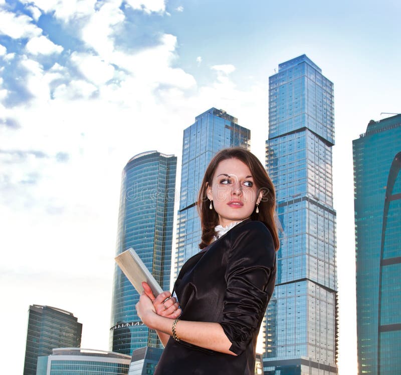 Young businesswomen with diary in her hands