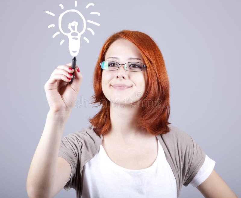 Young businesswomen with pen in hand