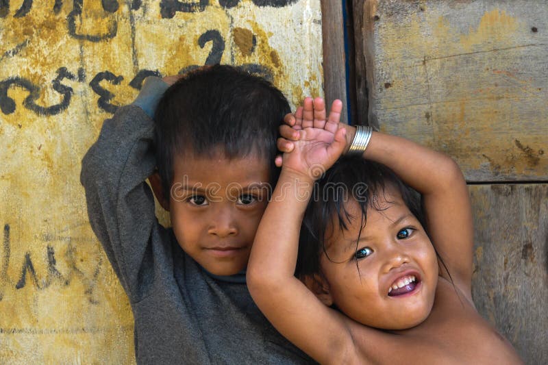 Two naked girls playing with one boy