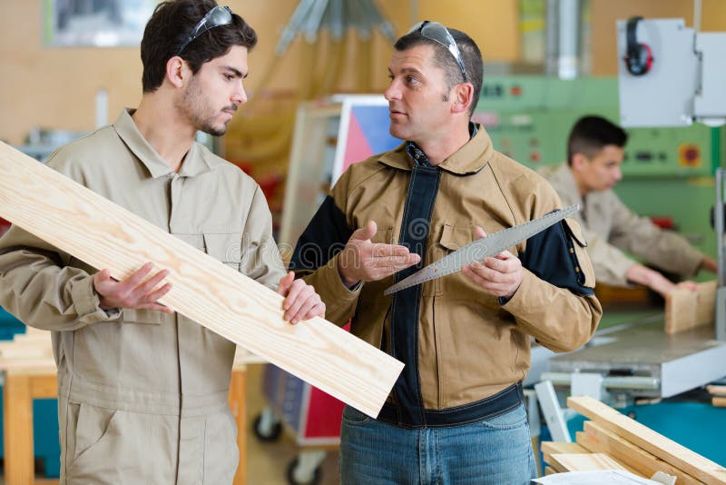Young Carpenter Receiving Instruction from Supervisor Stock Photo Image of manufacture, wooden