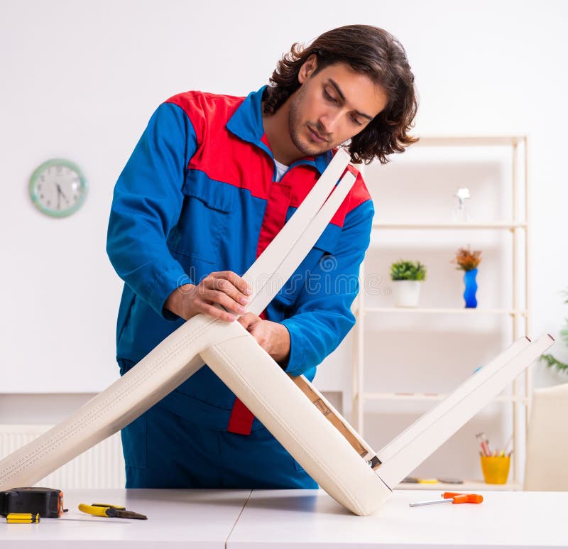 Young male carpenter working indoors royalty free stock photography
