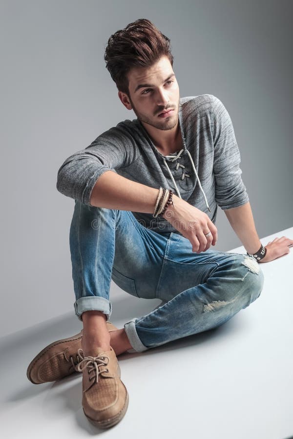 Young Casual Fashion Man Sitting On The Floor Stock Image - Image of ...