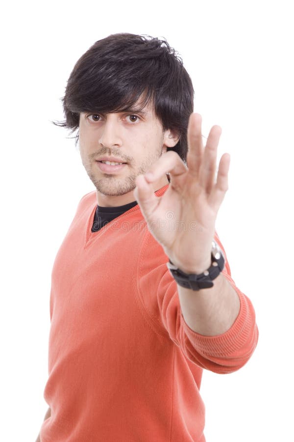 Young casual man signaling Ok royalty free stock photography