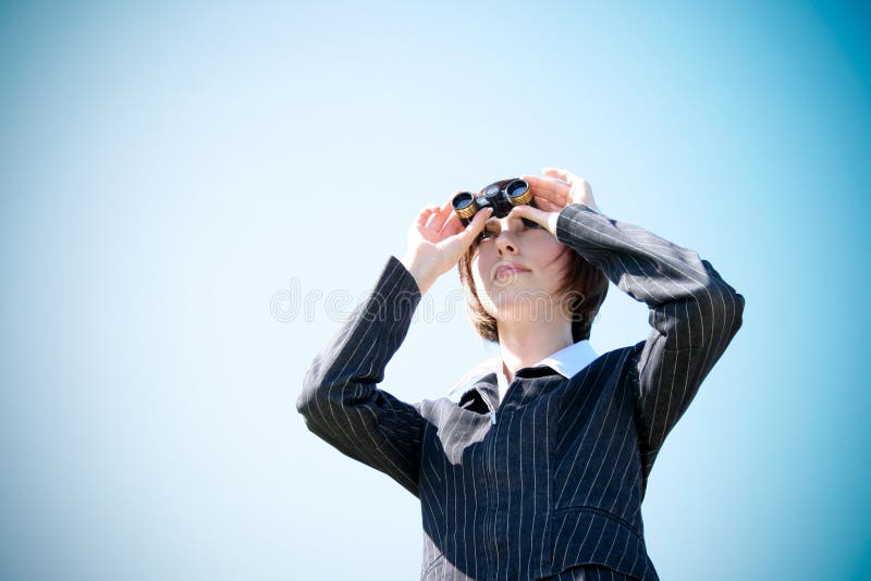 Young caucasian business lady with binoculars