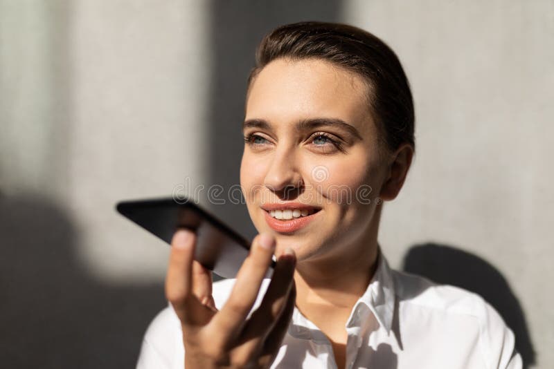 Young Caucasian businesswoman talking on mobile phone in office royalty free stock photo Young Caucasian businesswoman talking on mobile phone in office royalty free stock photo