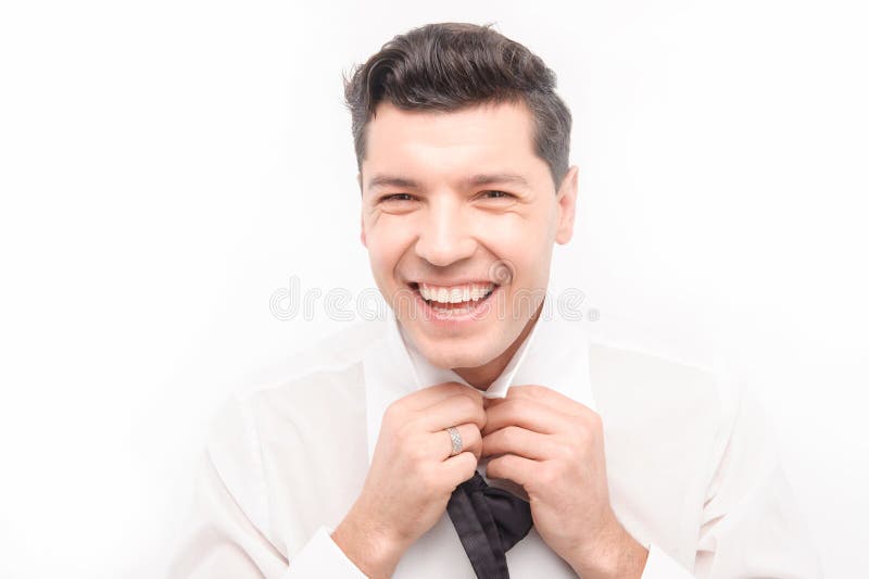 Young Caucasian dark hair man tie up stock photos