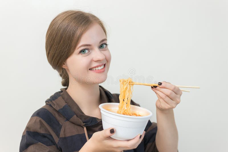 Young Caucasian Girl Woman Eating Instant Noodles Ramen With Chopsticks 