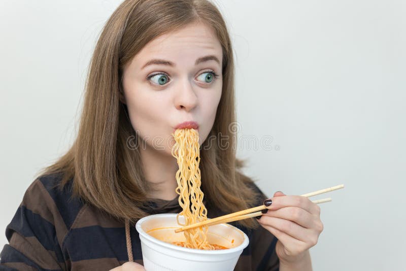 Young Caucasian Girl Woman Eating Instant Noodles Ramen With Chopsticks 