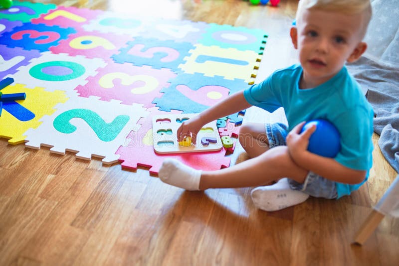 Young Caucasian Kid Playing at Kindergarten with Toys. Preschooler Boy ...