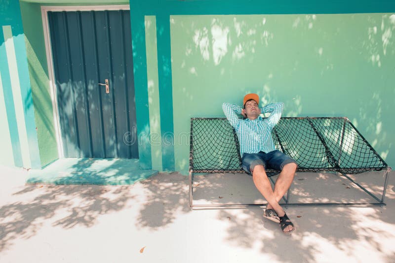 Young Caucasian Man Swinging in a Hammock Pleasant Laziness of Weekend ...